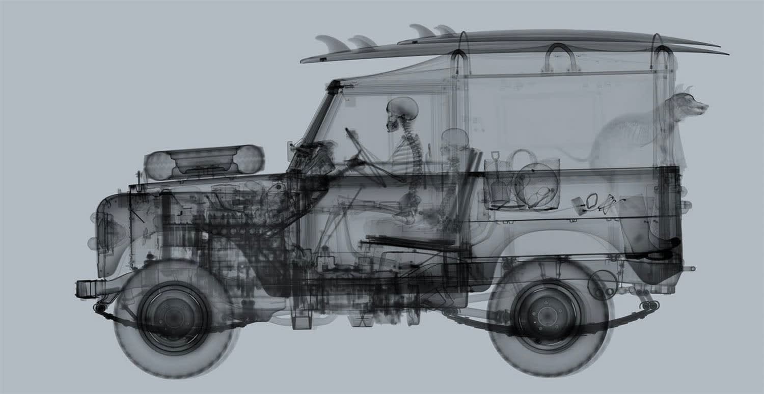 Nick Veasey X-ray photo of land rover with surf board and dog on grey background