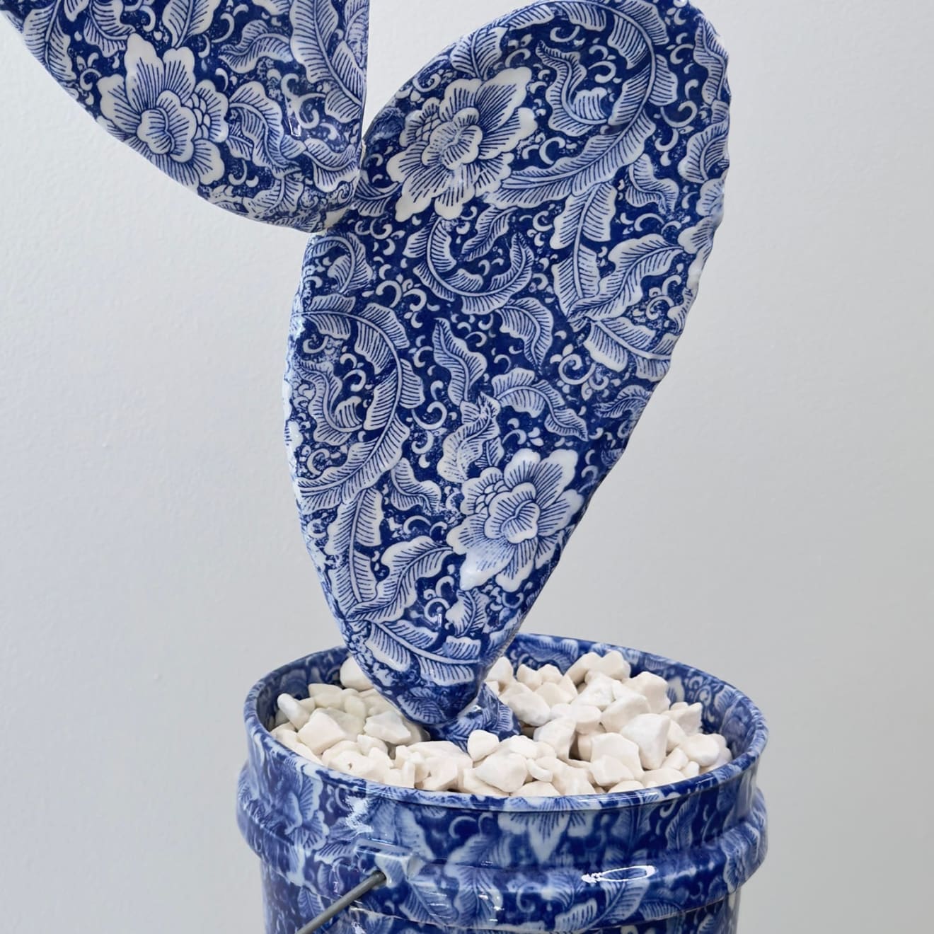 Brock DeBoer sculpture of porcelain cactus clipping in bucket with baroque porcei