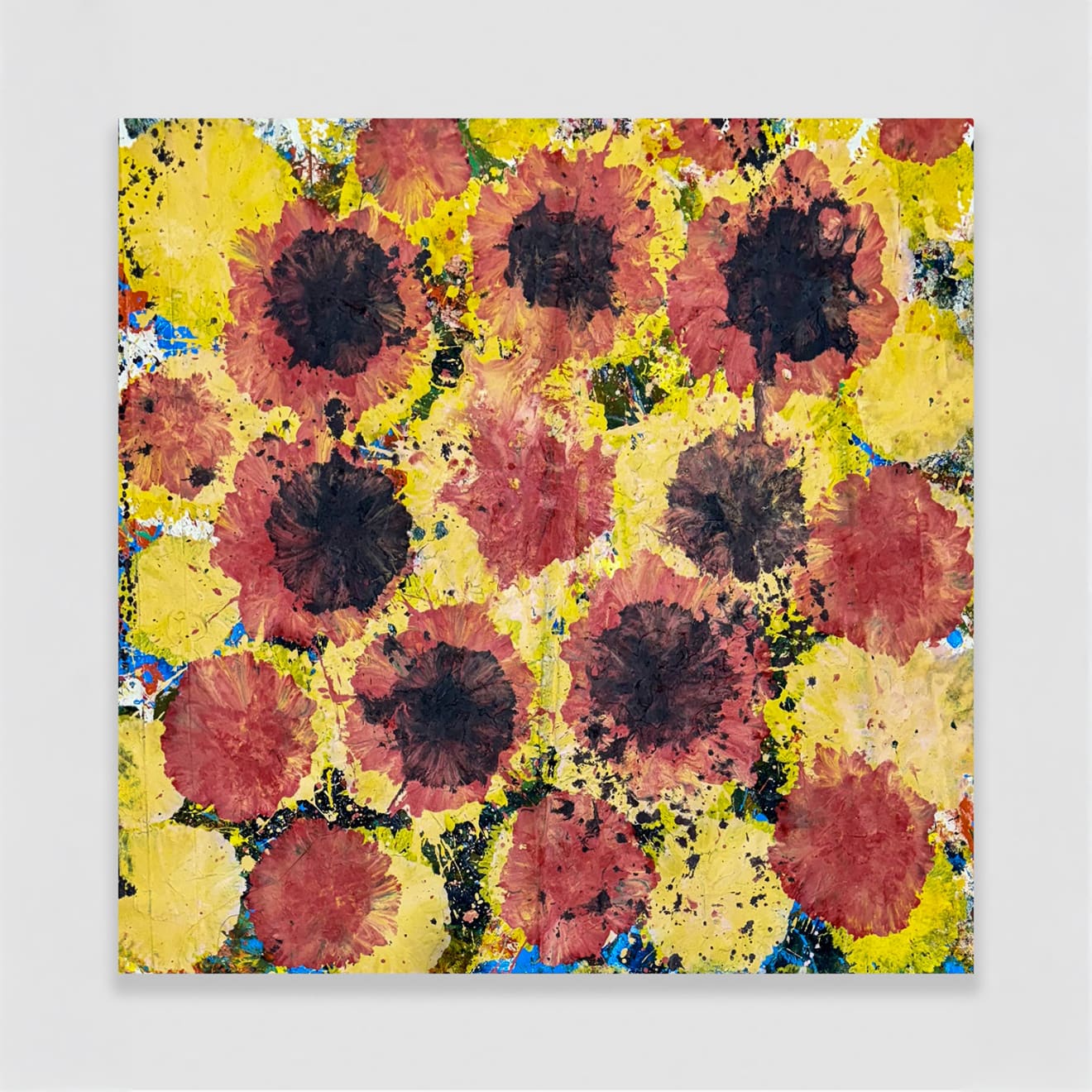 Jorge Luis Santos painting of yellow red and black spots on wall