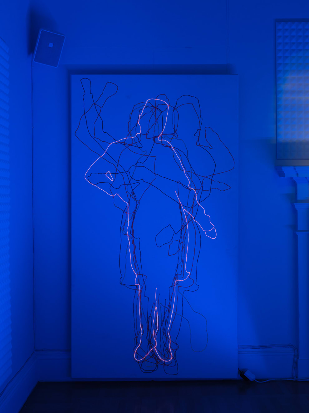 A person of indeterminate gender moves freely across the room