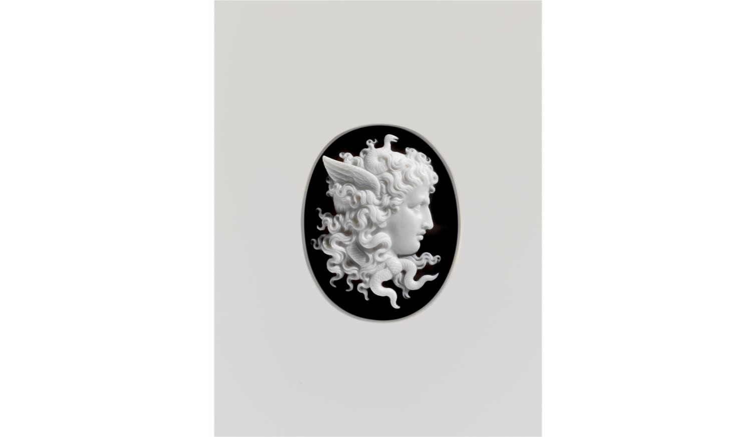 *, A Neoclassical silver, gold, ruby and onyx cameo brooch, 19th century