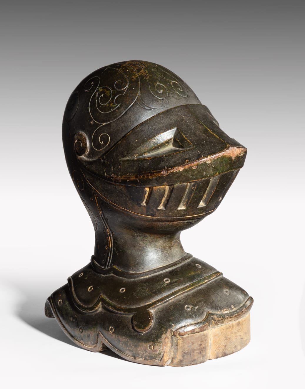 Coulborn antique patinated carved wood armet