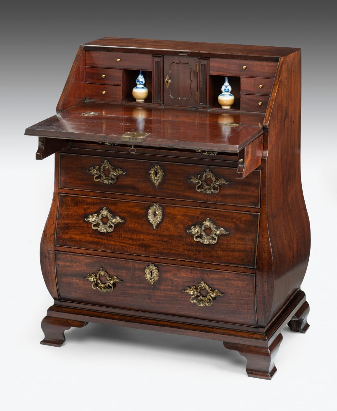 Coulborn antique George II mahogany bureau of bombe form and small proportions