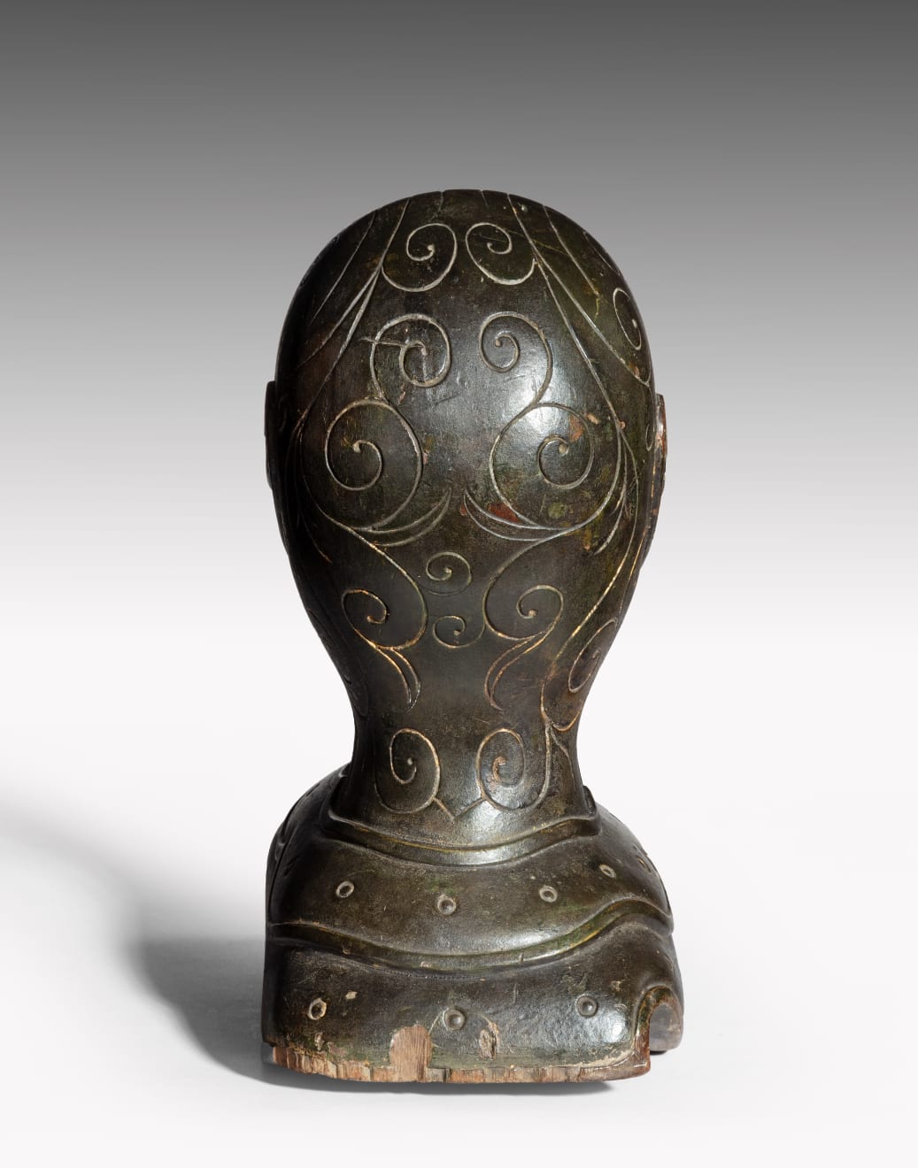 Coulborn antique patinated carved wood armet