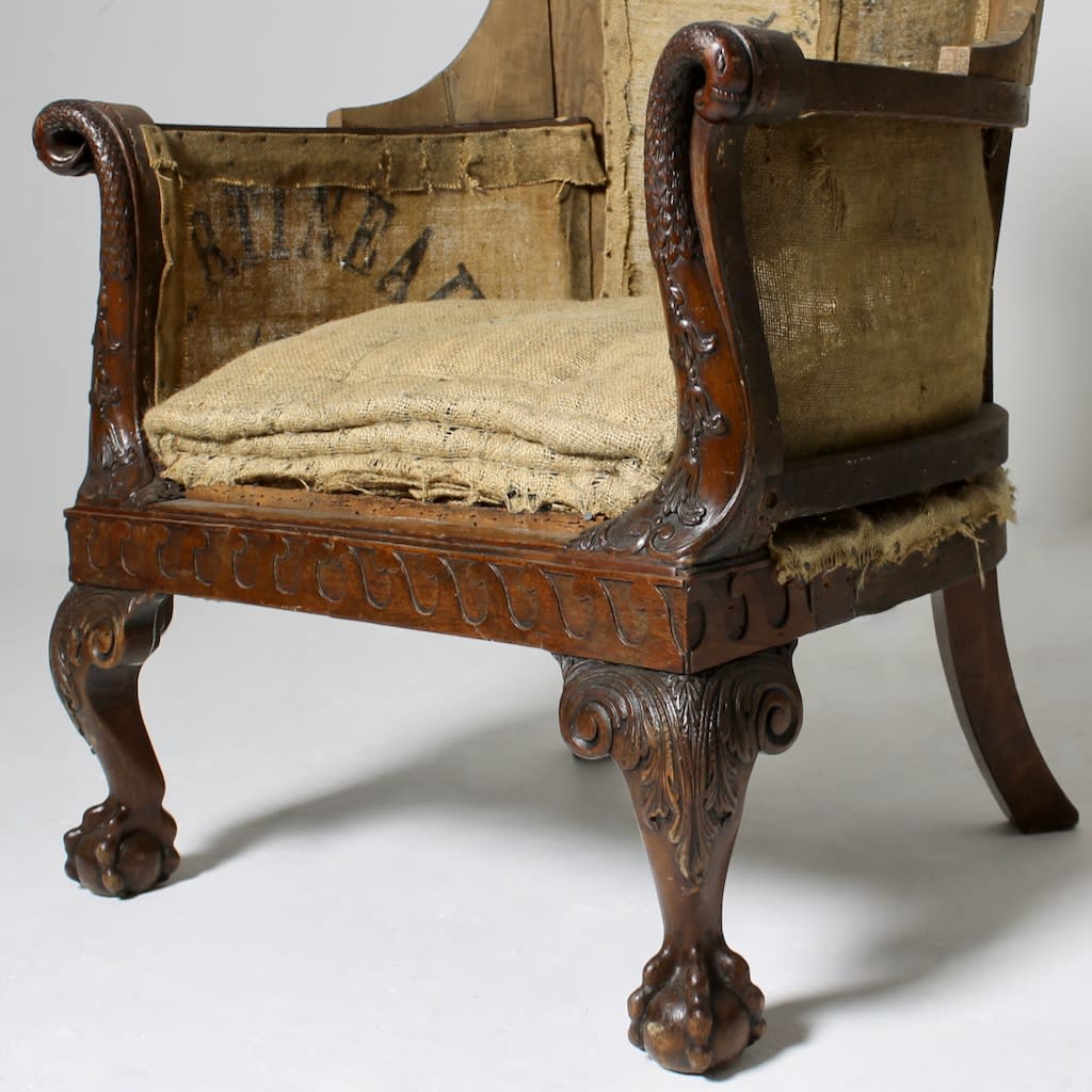 A LARGE 19th CENTURY CARVED MAHOGANY LIBRARY ARMCHAIR ( sold )
