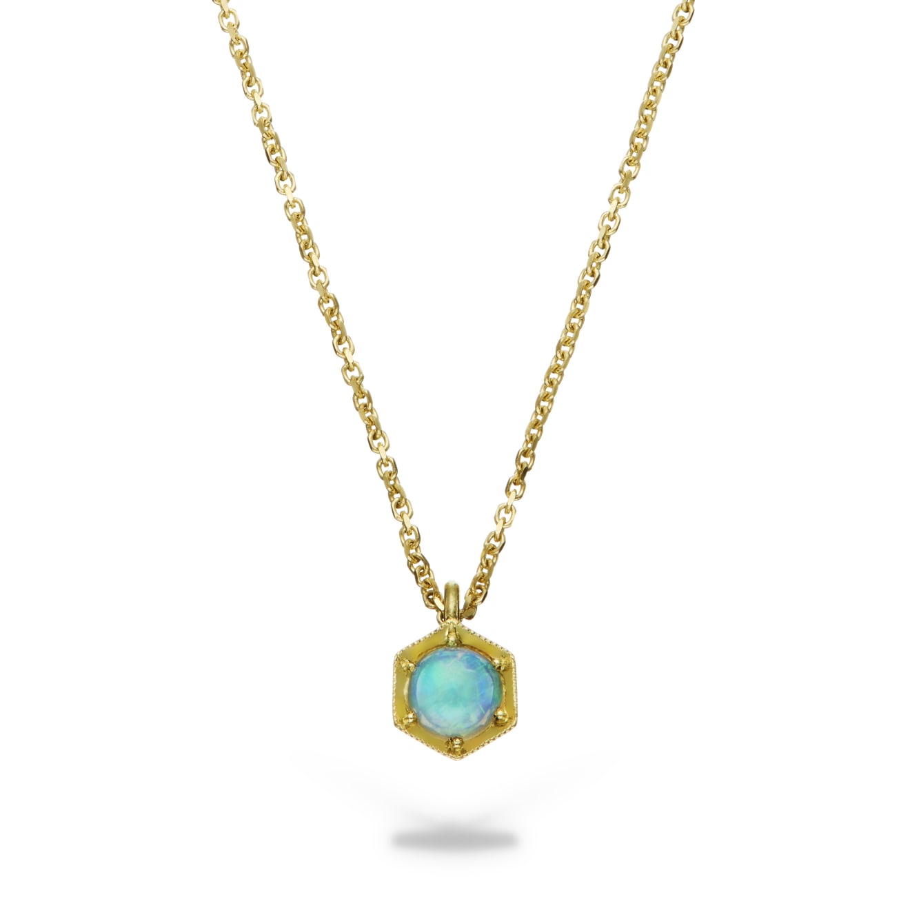 Aril Jewels Honeycomb opal pendant from Clara Collection with opal set in 18k yellow gold hexagon setting on fine 18k yellow gold chain. On white background