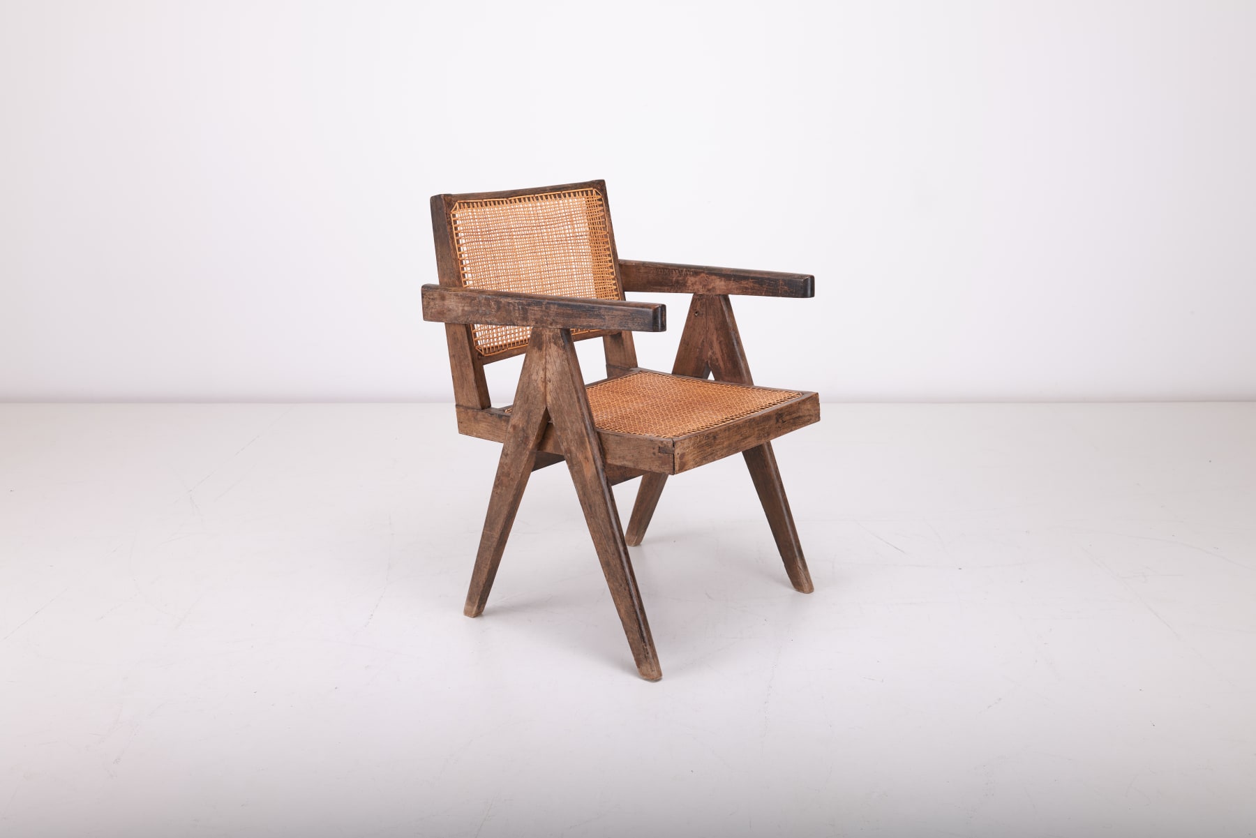 Pierre Jeanneret Conference Armchair with diagonal V-legs, crafted in teak and cane
