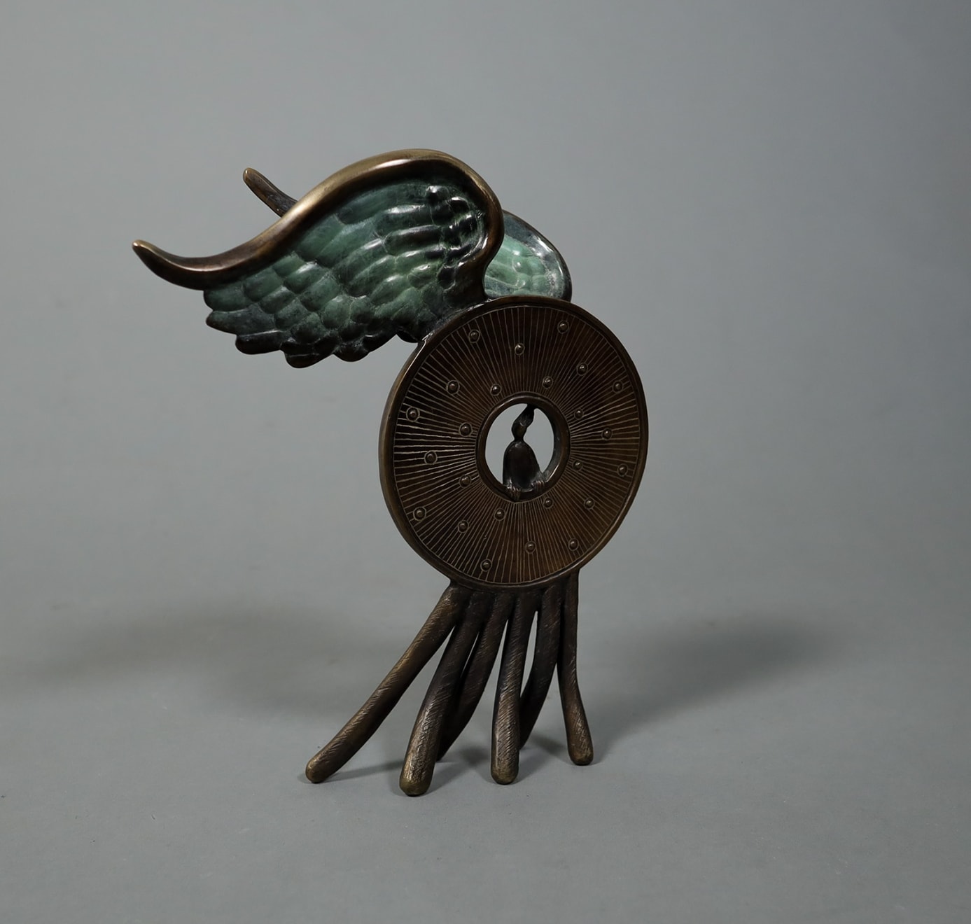 Marian Fountain, Winged Medal with Legs