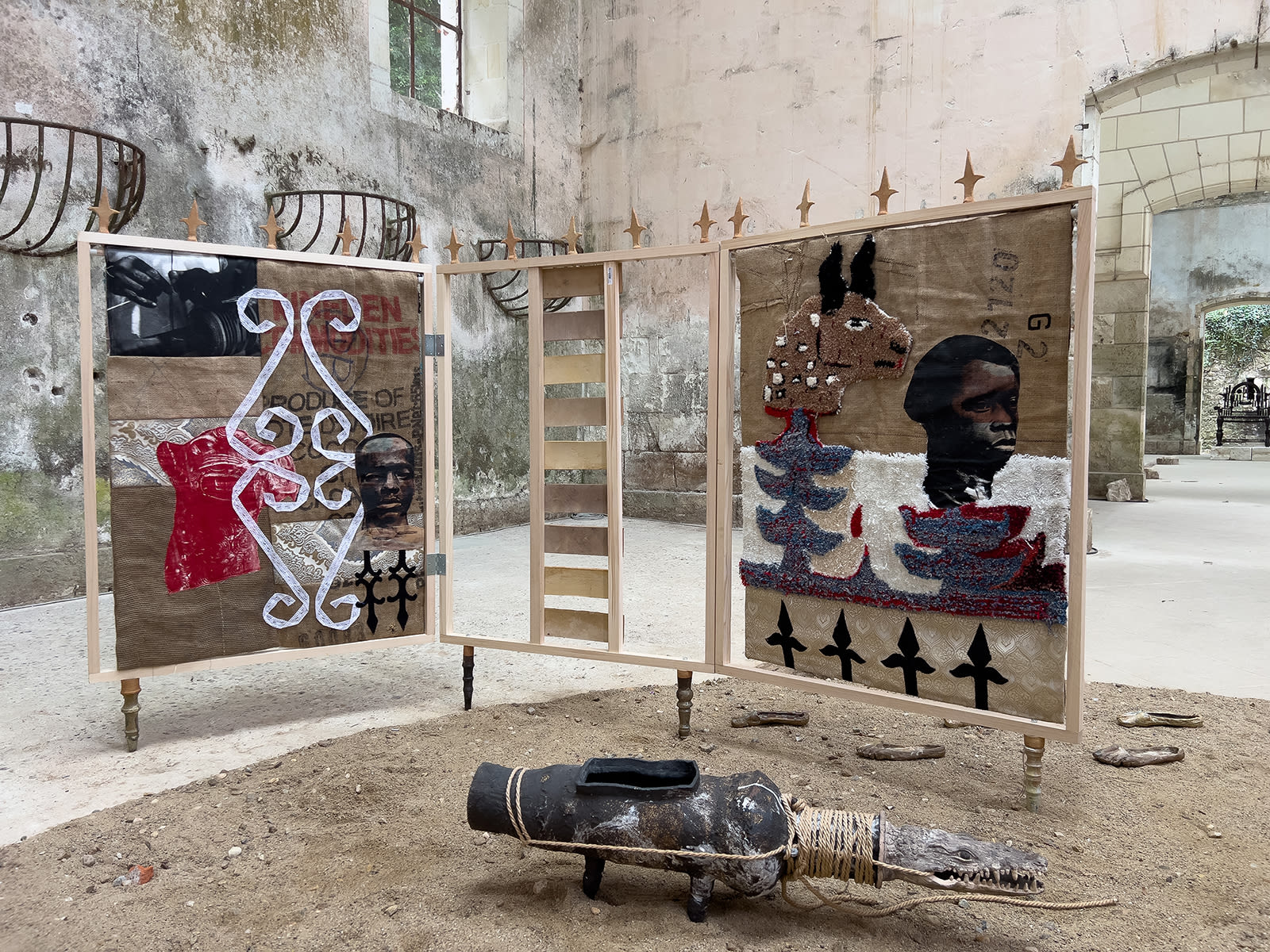 Screen made of tapestries and sculptures by Ivorian artist Chada at Château de Montgoger, exhibition NOIR MATTERS, Loire Valley