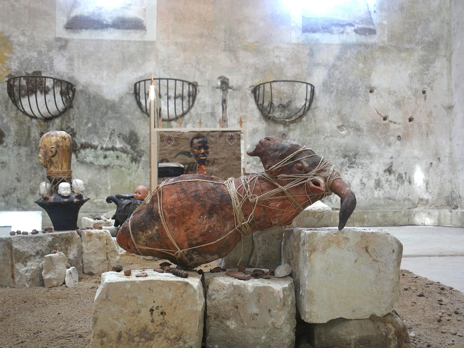 A sculpture of a got on stones as part of Chada's in-situ installation 'Pas très loin' (2025), at Château de Montgoger, Loire Valley, France