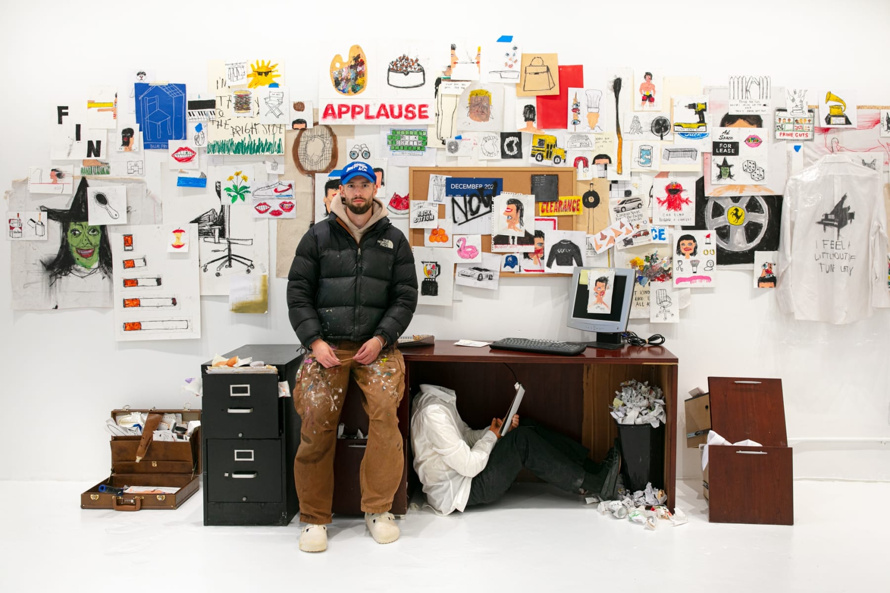 Artist Sage Barnes with "Employee Of The Month" installation