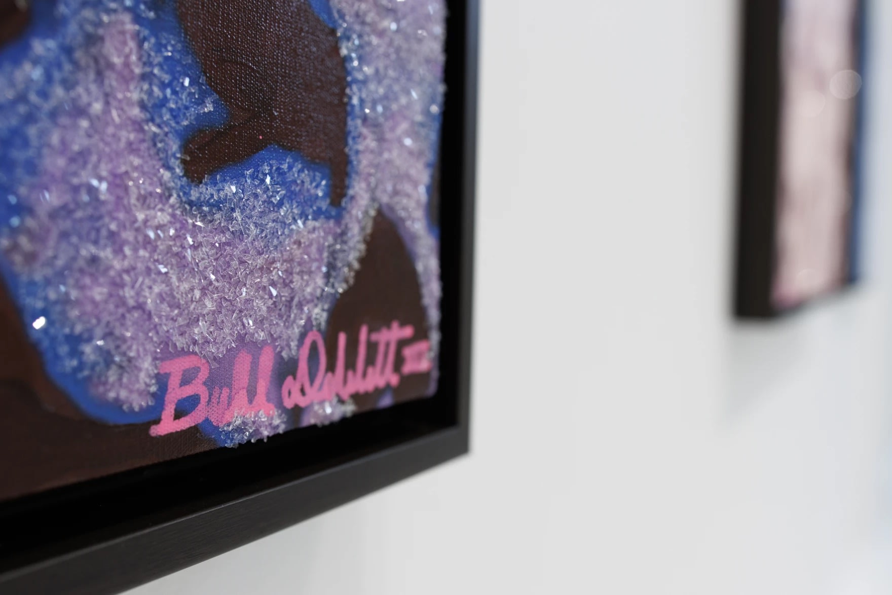 Close up with Bill DeWitt III "Skull" series painting with diamond dust at Square One Gallery. Photo by Sophie Proe / St.Louis Public Radio