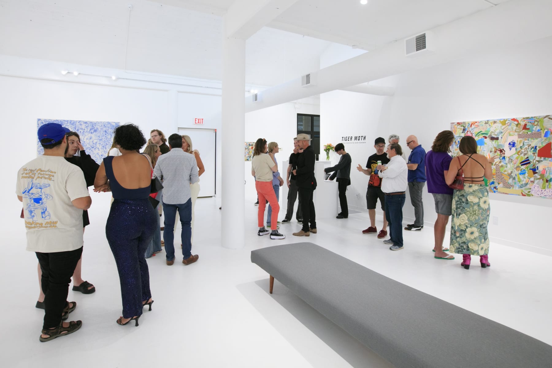 Guests at the opening reception of "Tiger Moth", a solo exhibition by Sarah Giannobile. Photo by Suzy Gorman