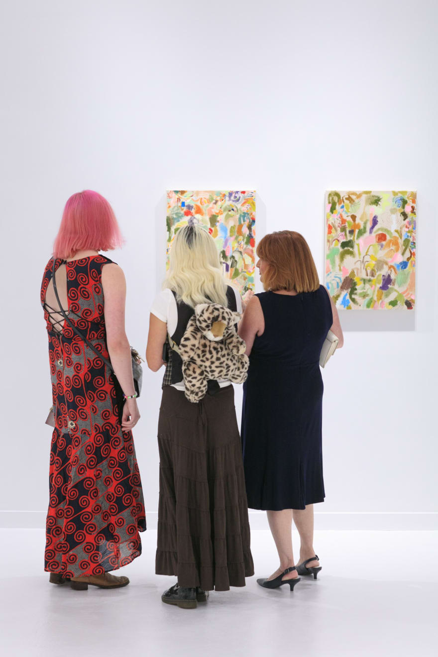Guests at the opening reception of "Tiger Moth", a solo exhibition by Sarah Giannobile. Photo by Suzy Gorman
