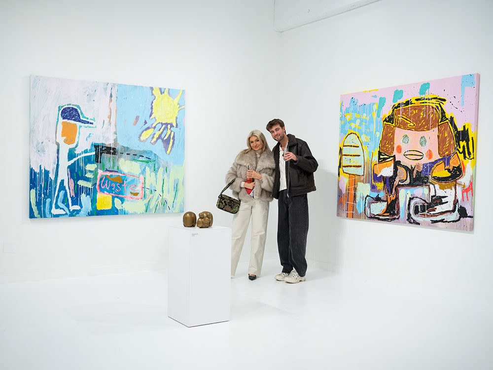Guests at Adam Handler's "Eagle King" exhibition opening reception