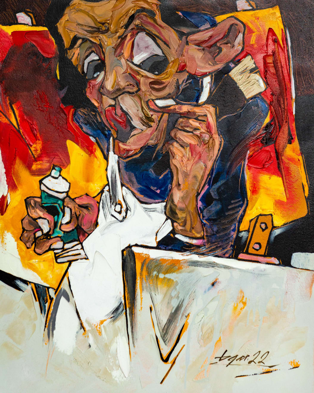 La Ba Quan, an artist squeezing a green paint tube while staring at his canvas, 2022