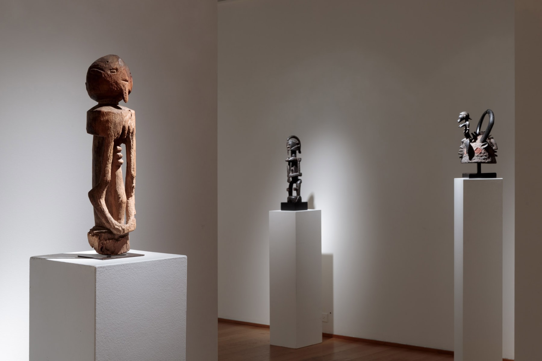 Dogon Figure; Dogon Figure; both from Mali; Senufo Helmet, Ivory Coast