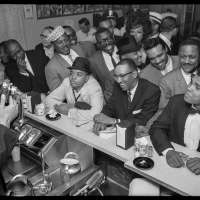 Black Muslim leader Malcolm X photographing Cassius Clay, Miami