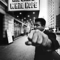 Boxing champion Muhammad Ali posing in front of the Alvin Theater during production of play "The Great White Hope", NY