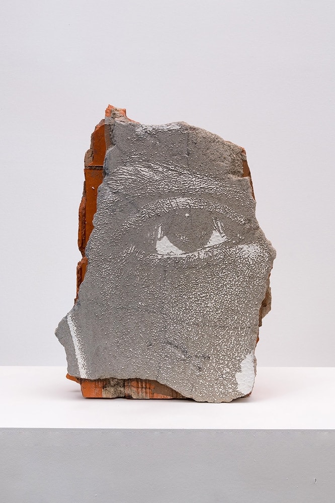 Vhils Shatter series #02 Laser-engraved fragment from demolished building (brick, plaster, concrete, paint) 54 x 41 x 15 cm