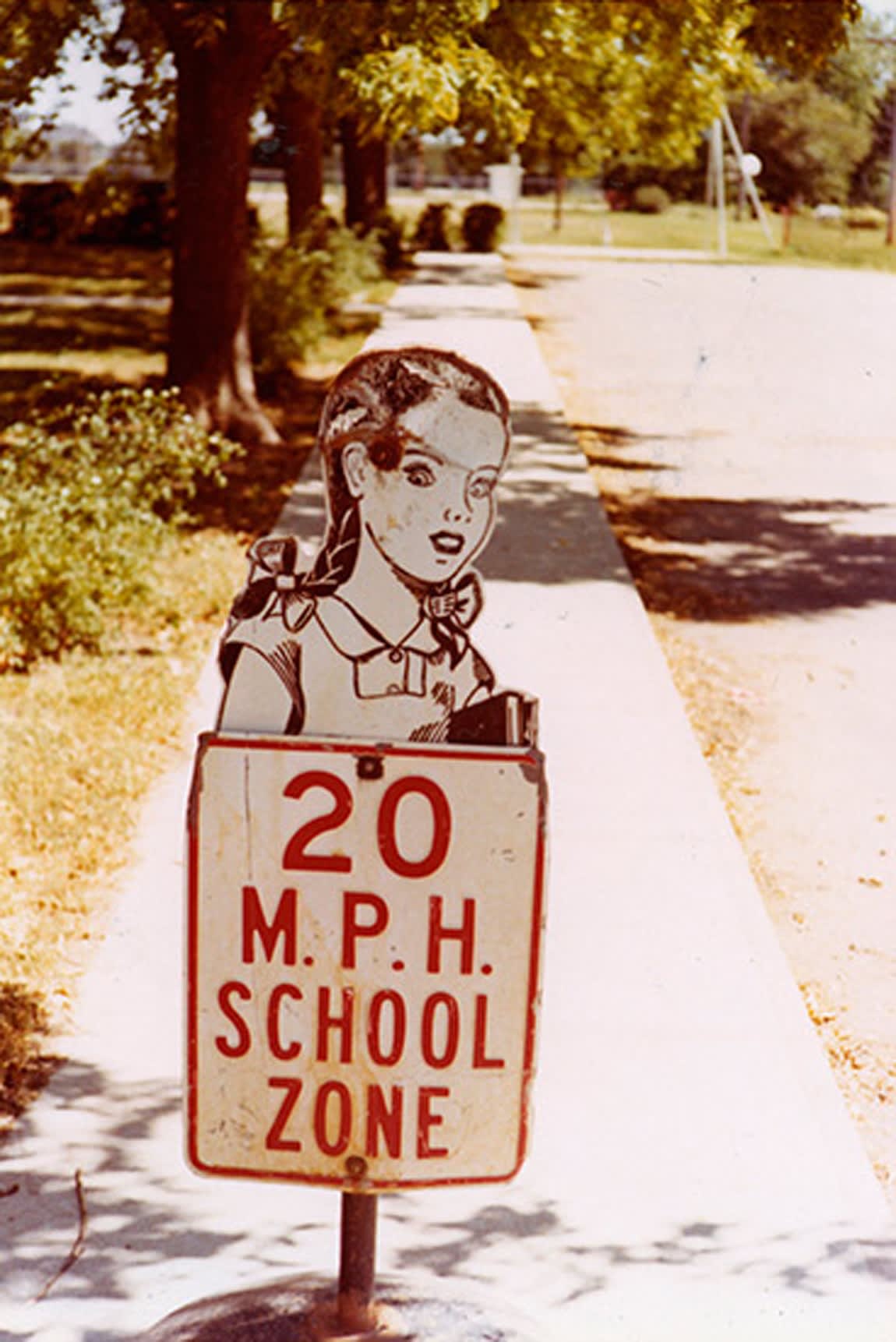 William Eggleston, Untitled (School Girl With Pigtails School Zone Sign), Memphis, 1970 (Printed 1970)