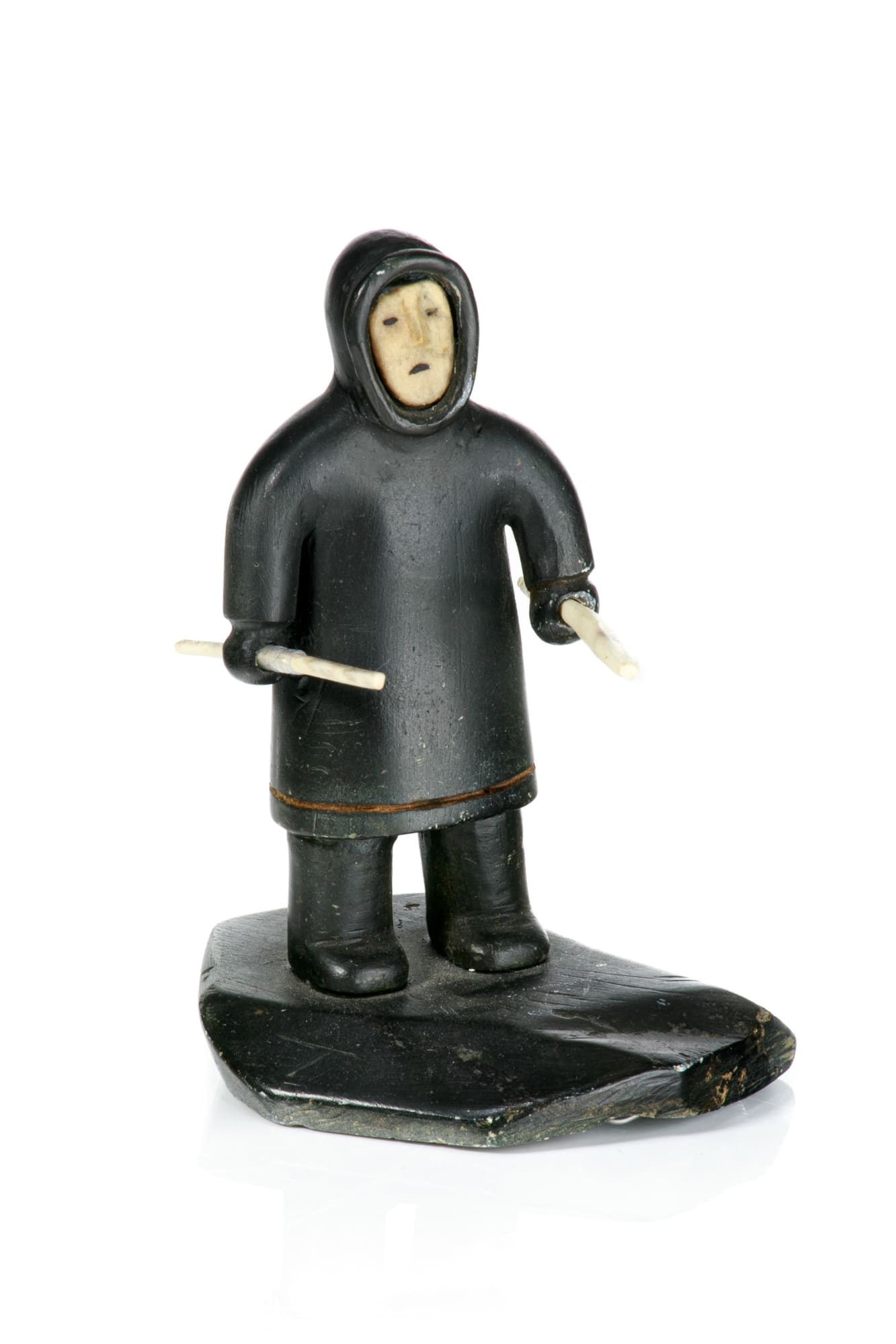 UNIDENTIFIED ARTIST, INUKJUAK (PORT HARRISON) Standing Hunter, 1950s stone, ivory, waxed string, and black ink, 5 x 3.5 x 3.5 in (12.7 x 8.9 x 8.9 cm) $500