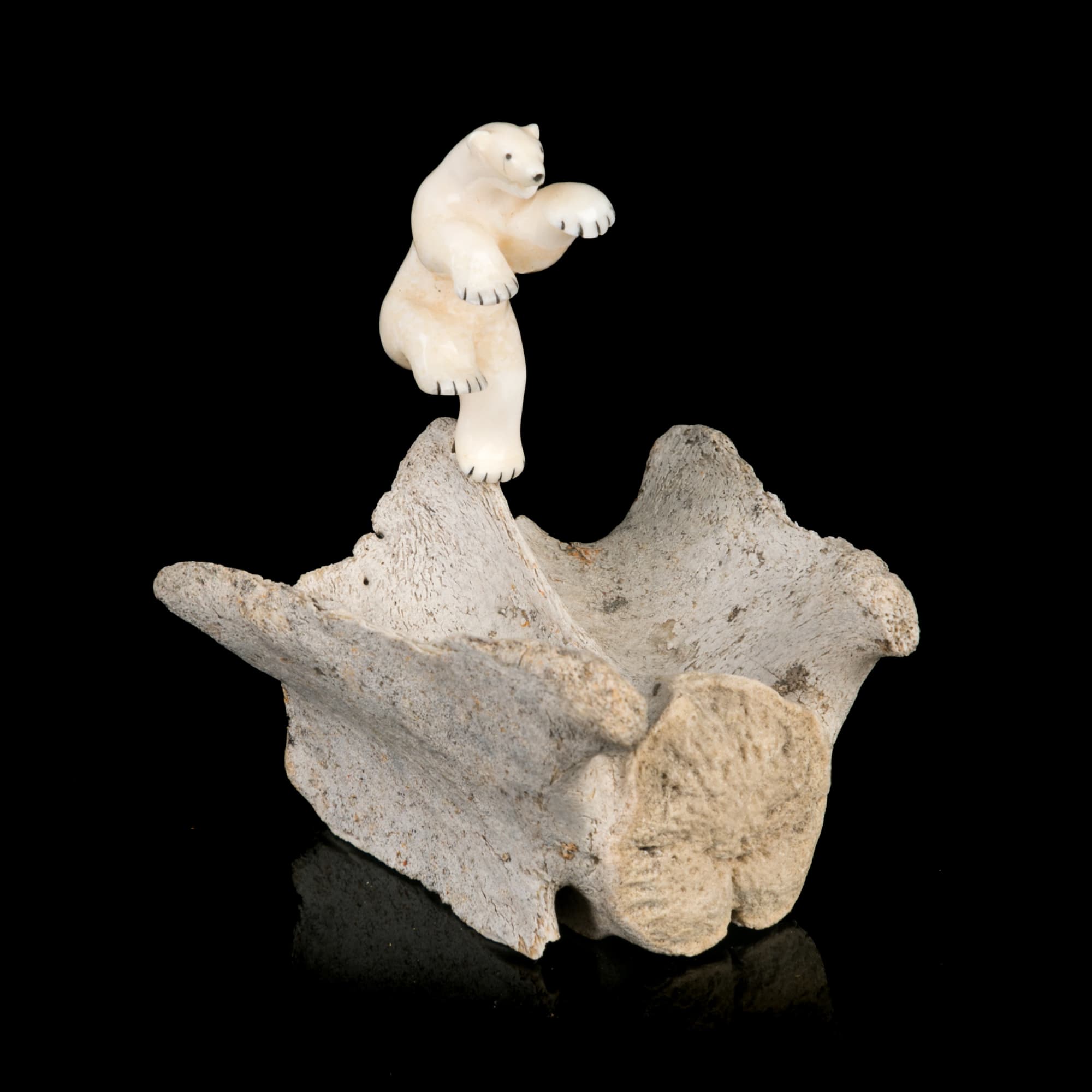 Lot 24 NICK SIKKUARK (1943-2013) ARVILIQJUAQ (PELLY BAY) Dancing Polar Bear, 1991 bone, ivory, and black inlay, 3.25 x 3 x 2.5 in (8.3 x 7.6 x 6.3 cm) ESTIMATE: $500 — $800 PRICE REALIZED: $1,586.00