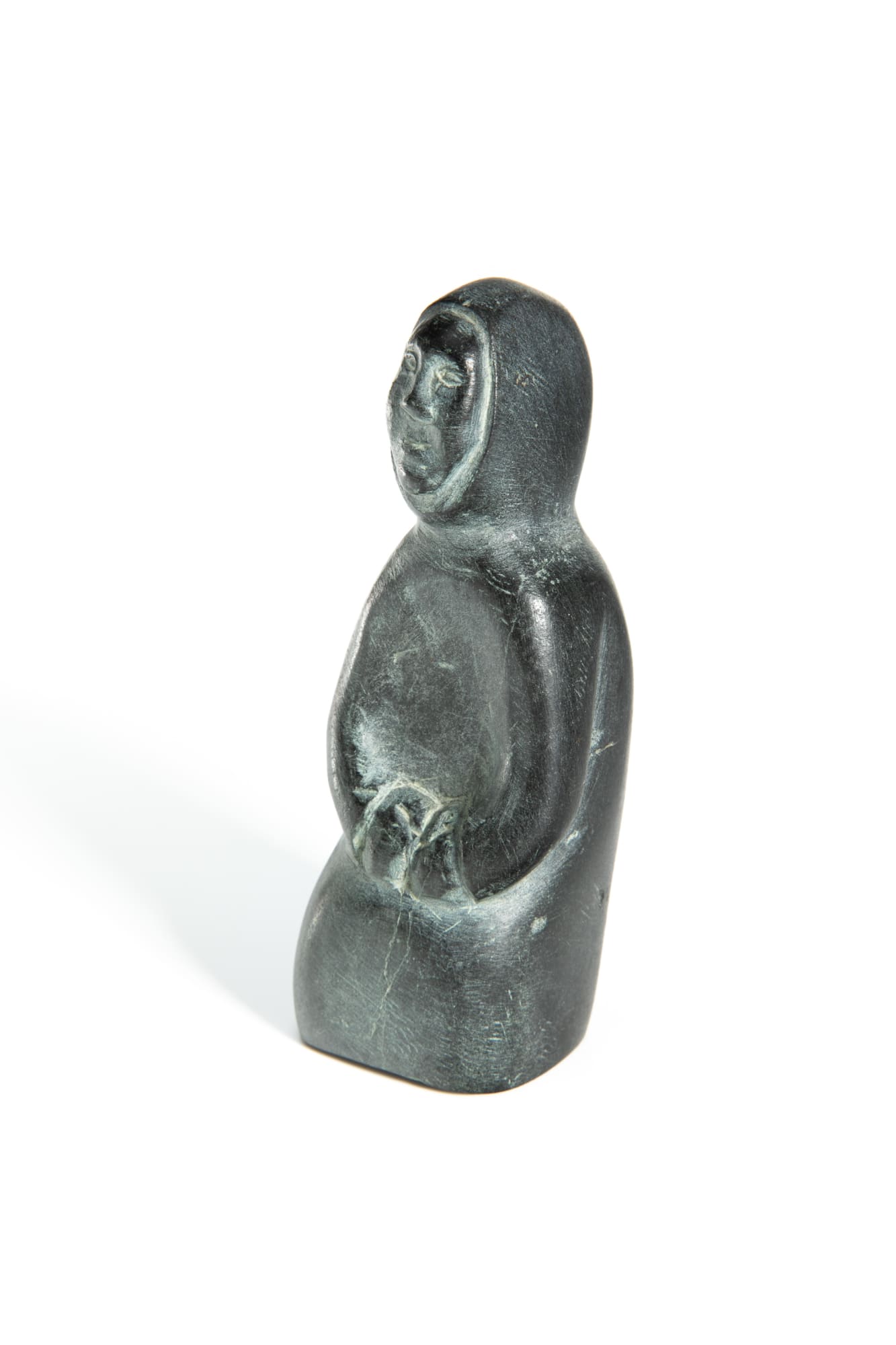 YVONNE KANAYUQ ARNAKYUINAK (1920-1988) QAMANI'TUAQ (BAKER LAKE) Kneeling Woman, c. 1980 stone, 5 x 1.75 x 1.5 in (12.7 x 4.4 x 3.8 cm) $650
