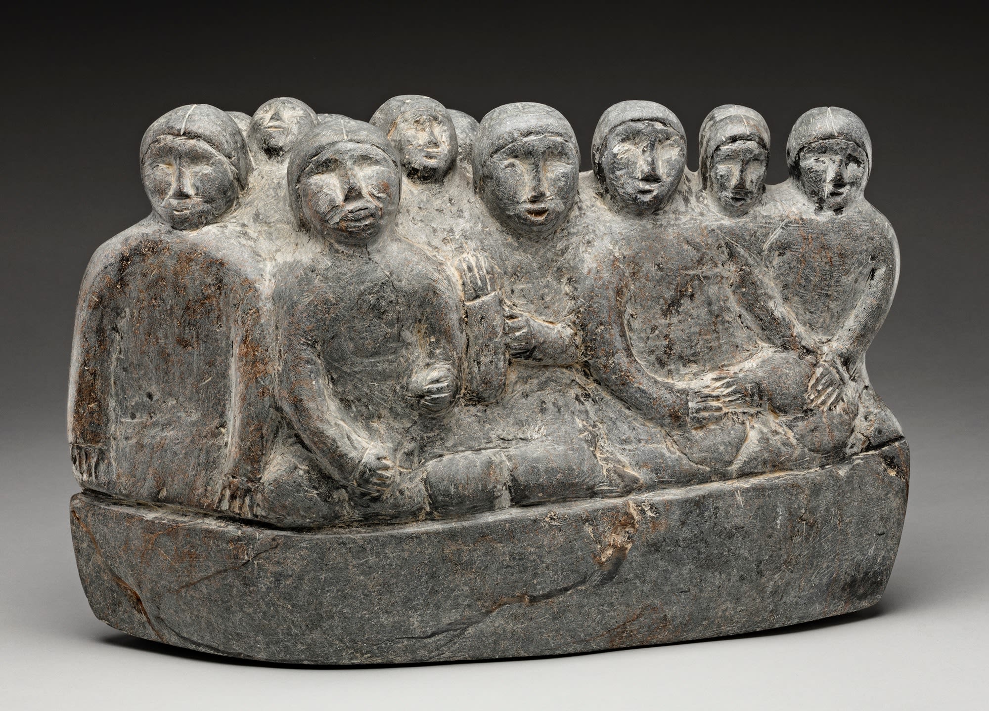 MIRIAM NANURLUQ QIYUK (1933-2016) QAMANI'TUAQ (BAKER LAKE) Family Gathering, mid 1990s stone, 9.75 x 15 x 6 in (24.8 x 38.1 x 15.2 cm)