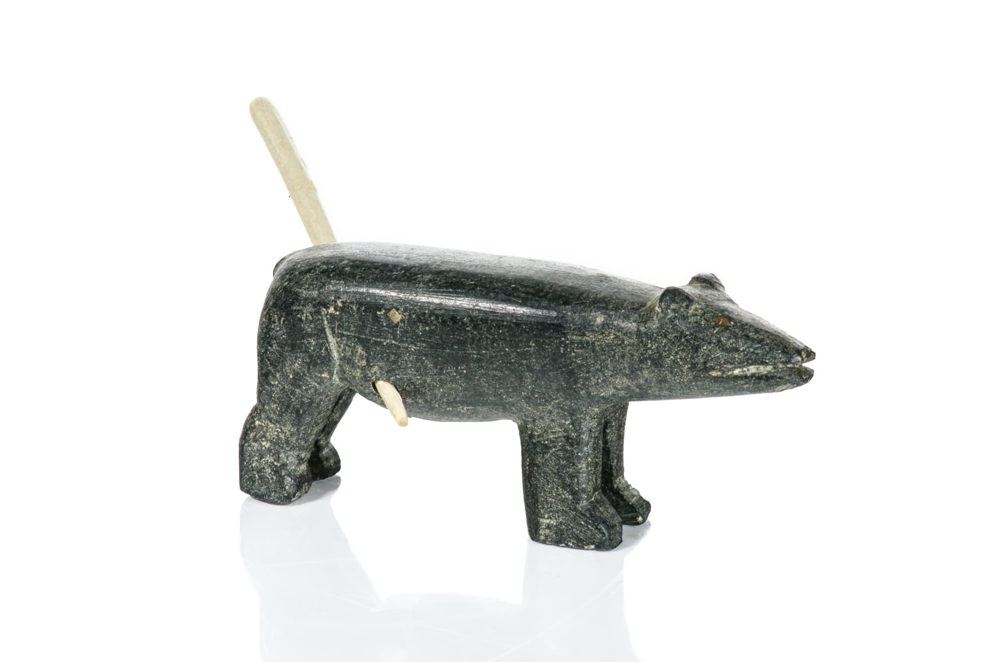 UNIDENTIFIED ARTIST, NUNAVIK (ARCTIC QUEBEC) Wounded Polar Bear, c. 1960 stone and ivory, 1.75 x 3.5 x 1 in (4.4 x 8.9 x 2.5 cm) $400