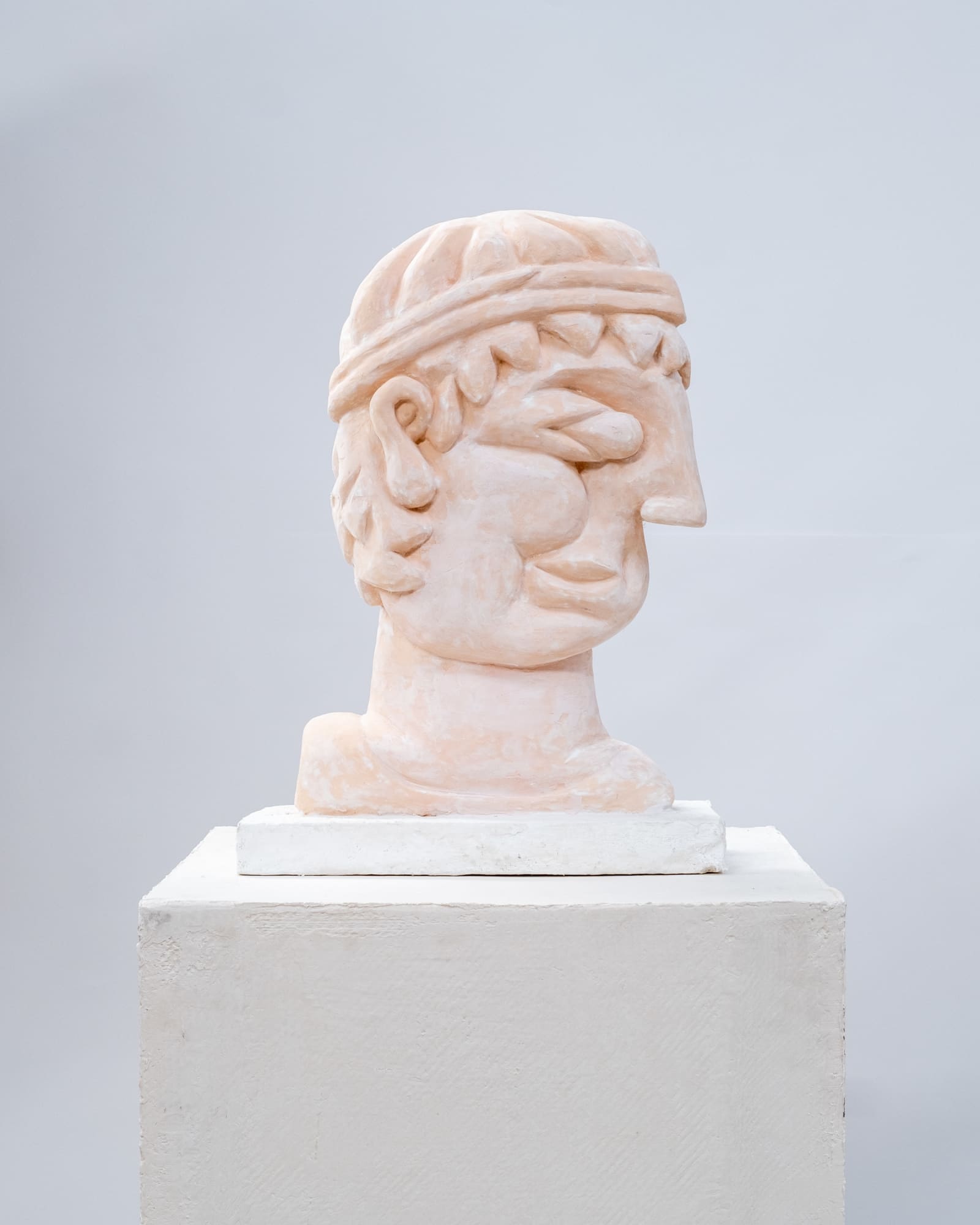 Florian Tomballe, Relief of a young man with headband, 2024