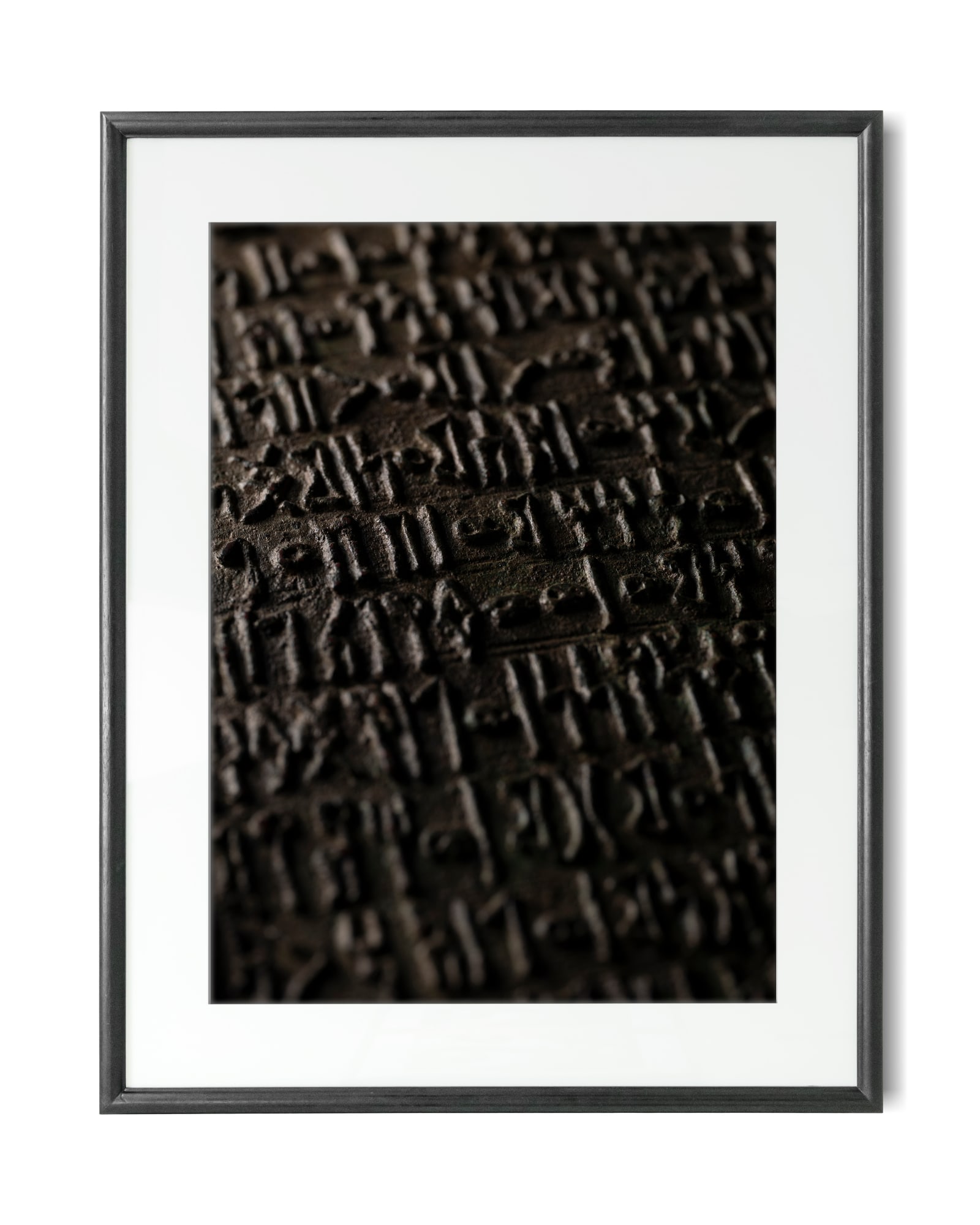 Jaron James, A photographic print of a South Arabian bronze plaque, 2022