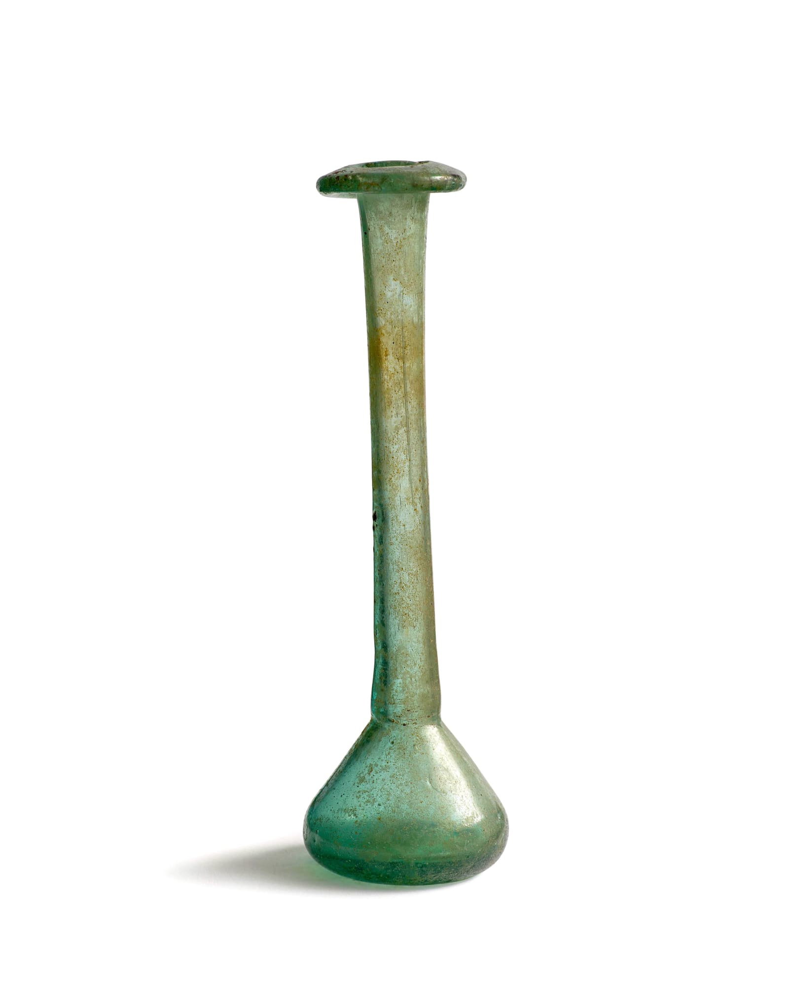 Roman, A Roman green glass unguentarium, circa 2nd - 3rd century AD