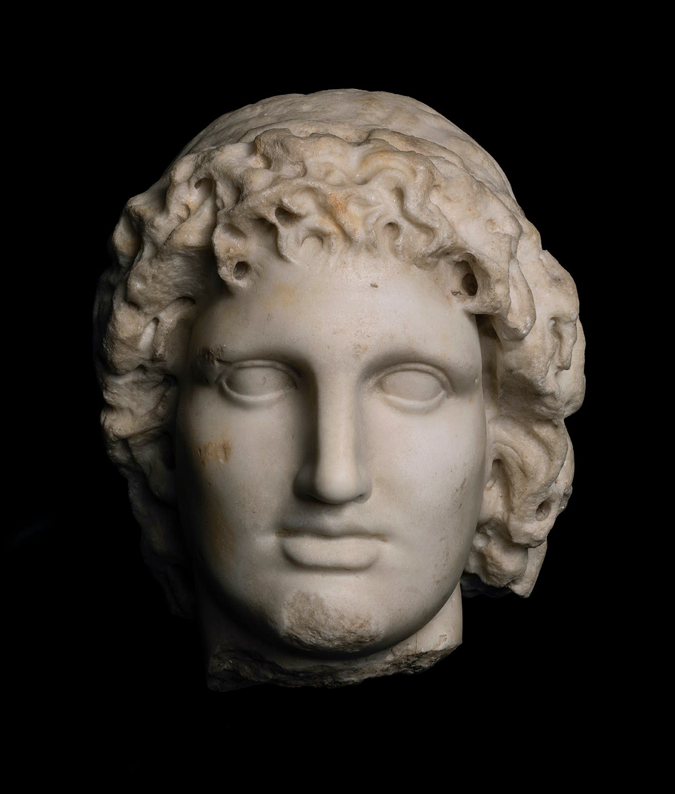 Roman, A Roman marble head of Helios, after Alexander the Great, Imperial, circa 2nd century AD