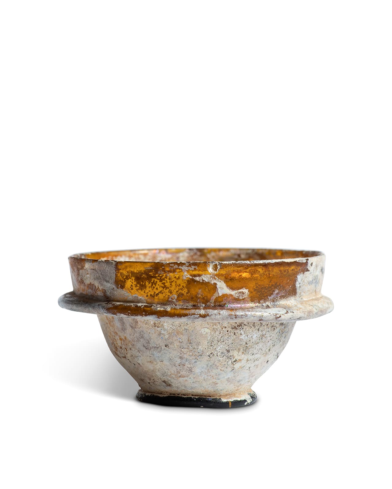 Roman, A Roman amber glass cup, Eastern Mediterranean, circa 3rd - 5th century AD
