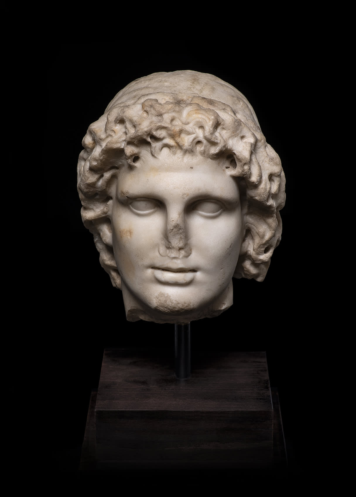 Roman, A Roman marble head of Alexander the Great as Helios, circa 2nd century AD