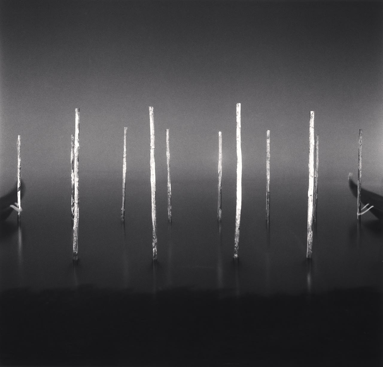 Michael Kenna, Twelve Night Docking Poles, Venice, 2022
