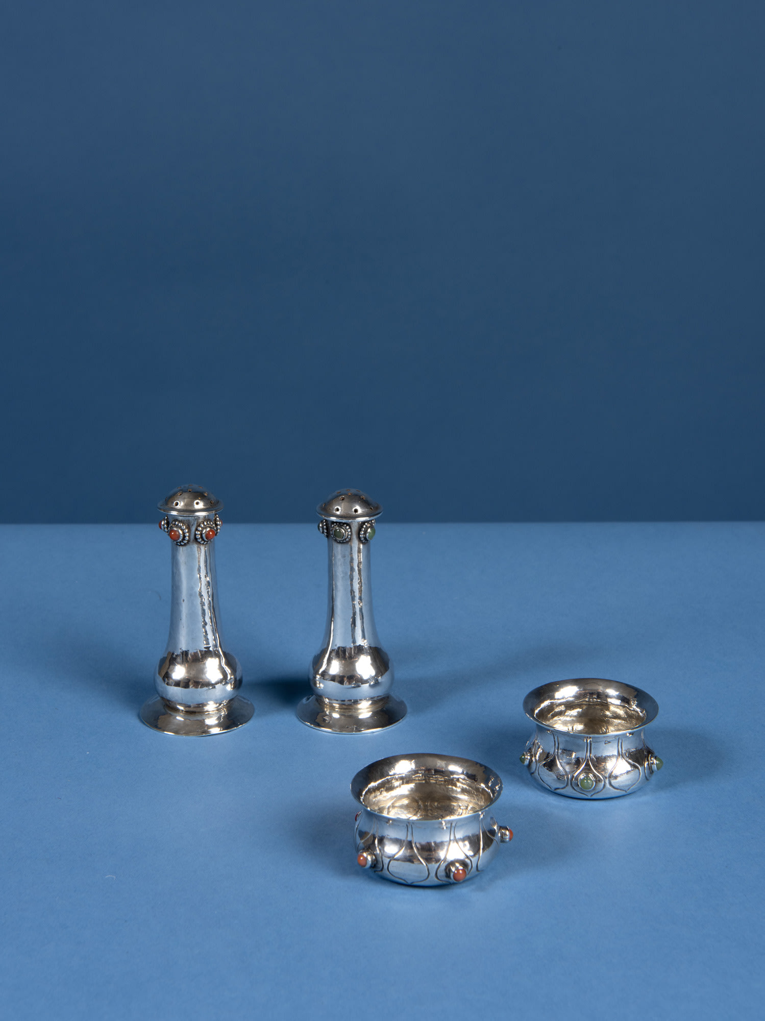 Charles Ashbee, A set of four salt and peppers, c.1900