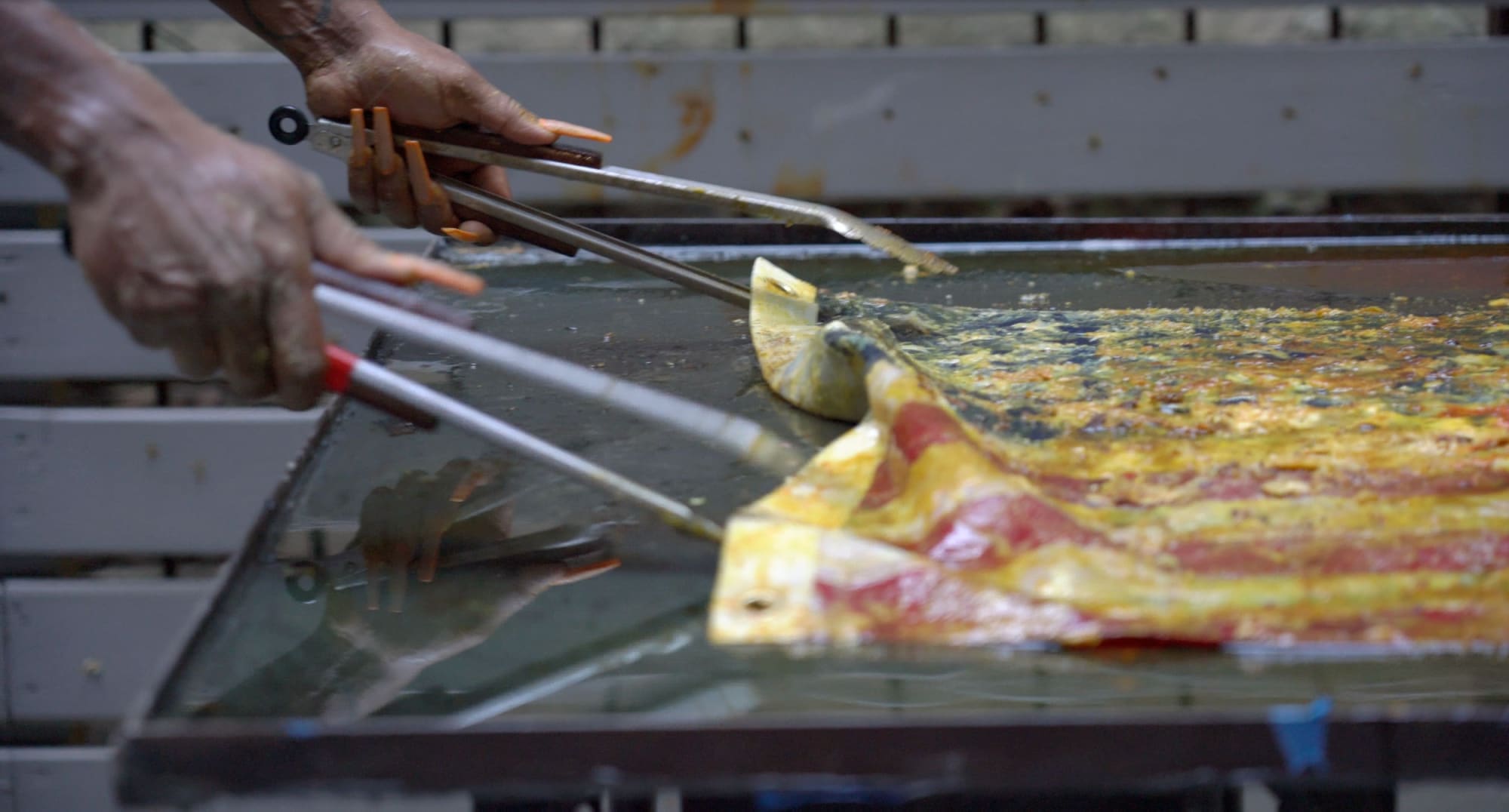 Kiyan Williams Flag Fry performance documentation, June 5, 2022 Lyles & King Outdoor Sculpture Space 21 Catherine Street, New York In conjunction with Kiyan Williams, Un/earthing, 2022 Lyles & King, New York