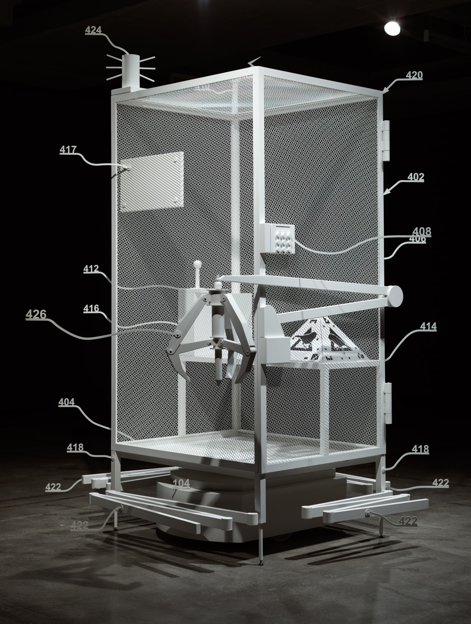 Simon Denny Amazon worker cage patent drawing as virtual King Island Brown Thornbill cage (US 9,280,157 B2: “System and method for transporting personnel within an active workspace”, 2016), 2019 Powder-coated metal, medium-density fiberboard, plastic, digital print on cardboard, iOS augmented-reality interface 47 1/4 x 39 3/8 x 106 1/4 in 120 x 100 x 270 cm