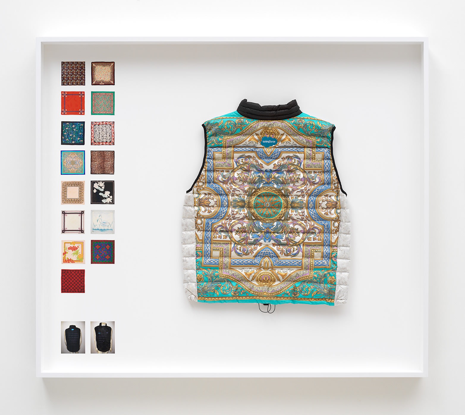 Simon Denny Power Vest 3, 2019 Scarf formerly owned by Margaret Thatcher, Patagonia M's Down Sweater Vest parts, Down sourced from second hand San Francisco garments, Ripstop Nylon, Salesforce and Quip embroidered logos, wood, glass, photo paper, cardboard 52 3/4 x 60 1/4 x 9 1/8 in 134 x 153 x 23 cm