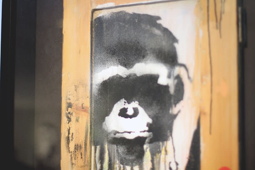 Banksy War Boutique monkey piece hanging at Andipa Gallery detail