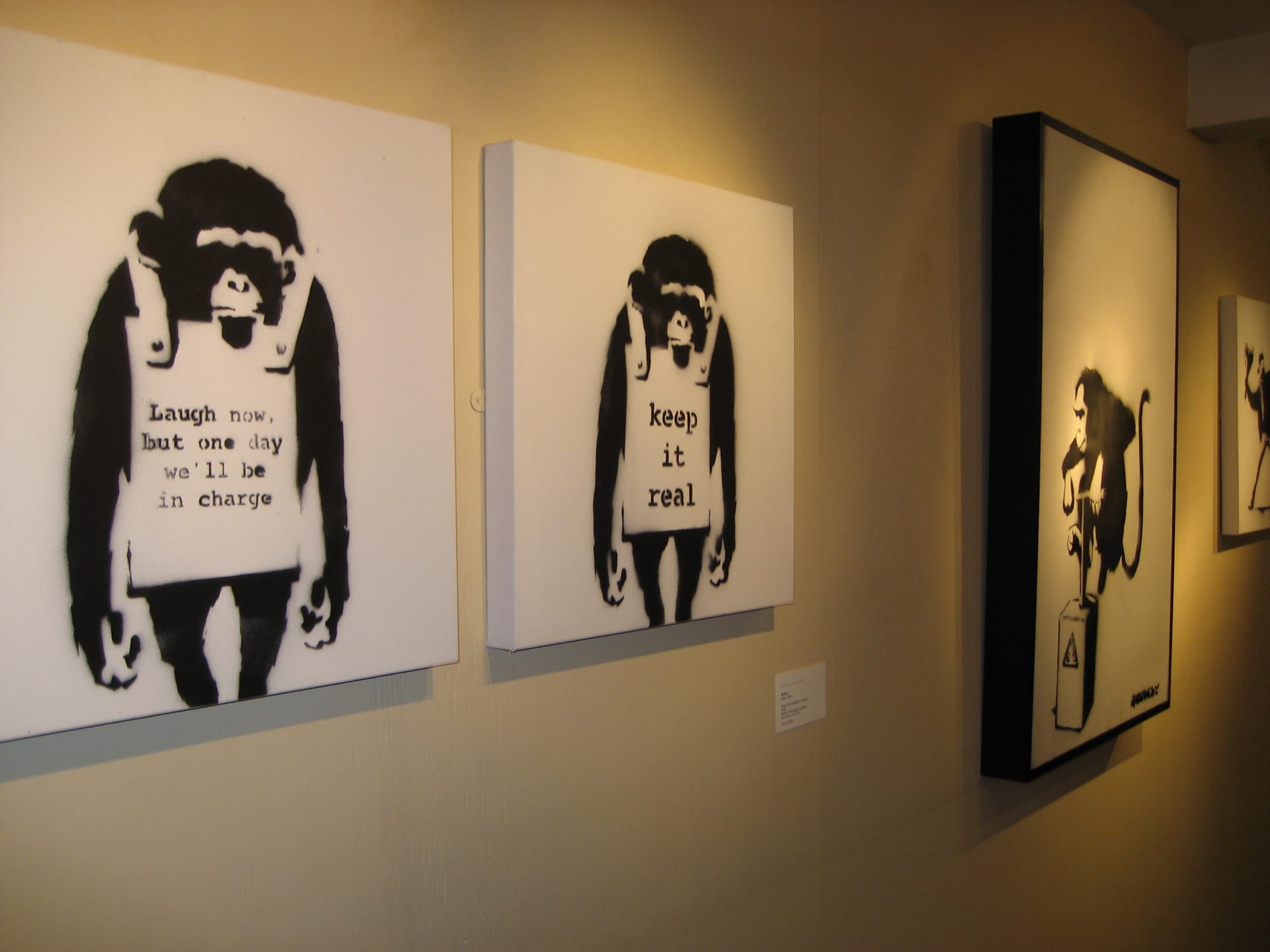 Banksy artworks hanging on wall
