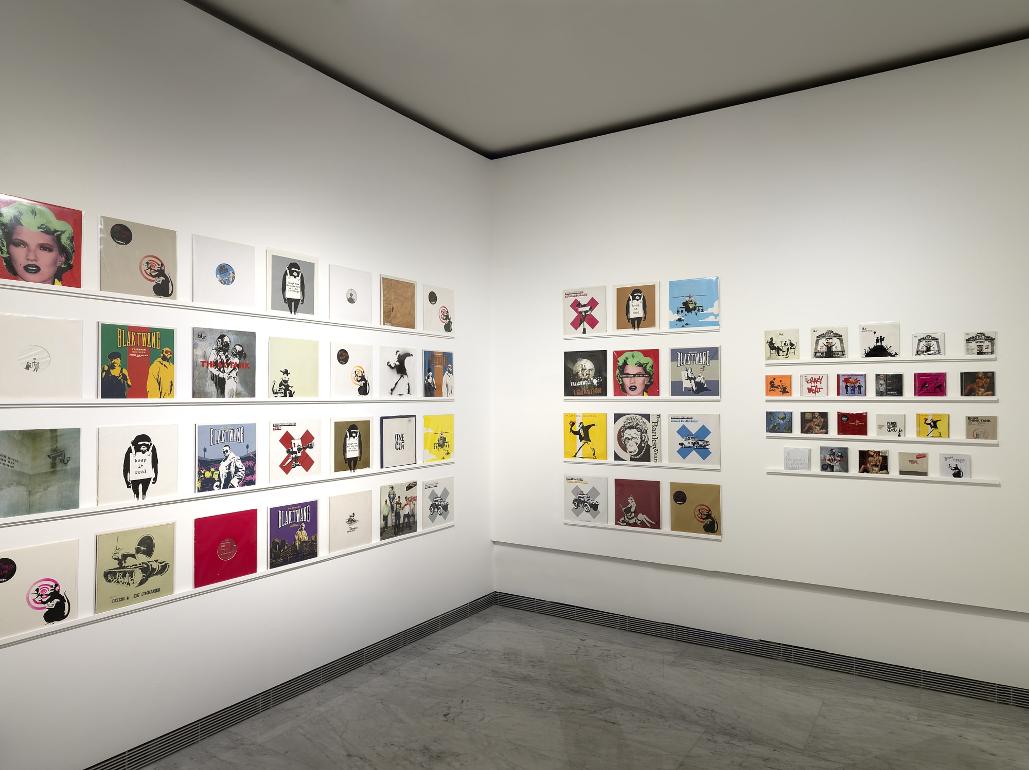 Banksy artworks hanging on wall