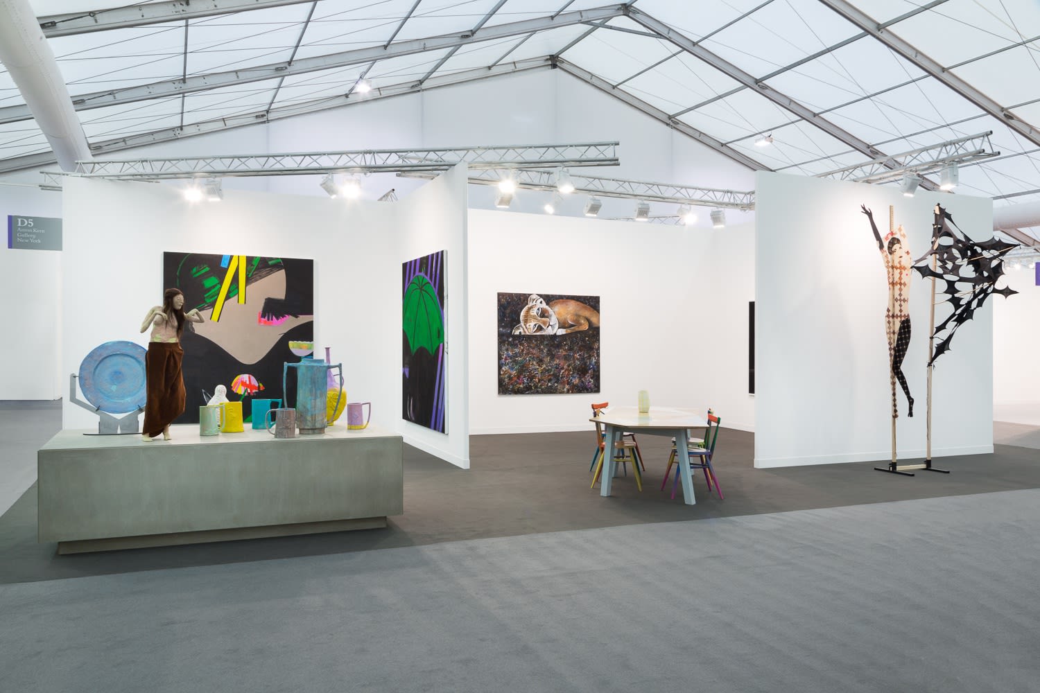 Installation view of a grouping of works at the fair by various artists.
