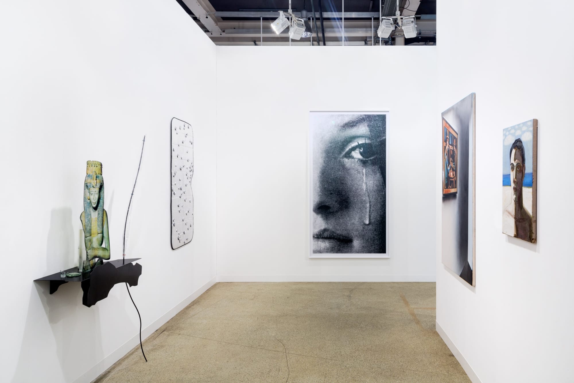 Installation view of Art Basel. featuring many artists in the gallery's program, among them Nicole Eisenman, Alessandro Pessoli, and Sasnal.