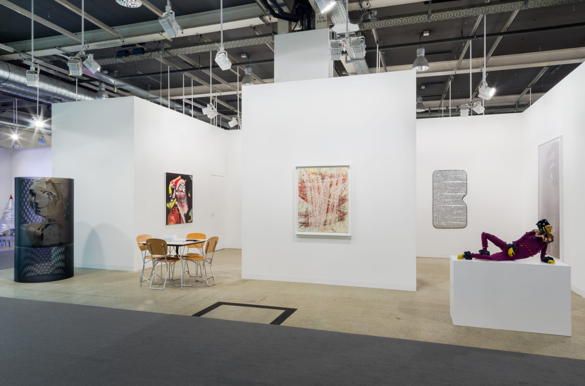 Installation view of Art Basel. featuring many artists in the gallery's program, among them Nicole Eisenman, Alessandro Pessoli, and Sasnal.