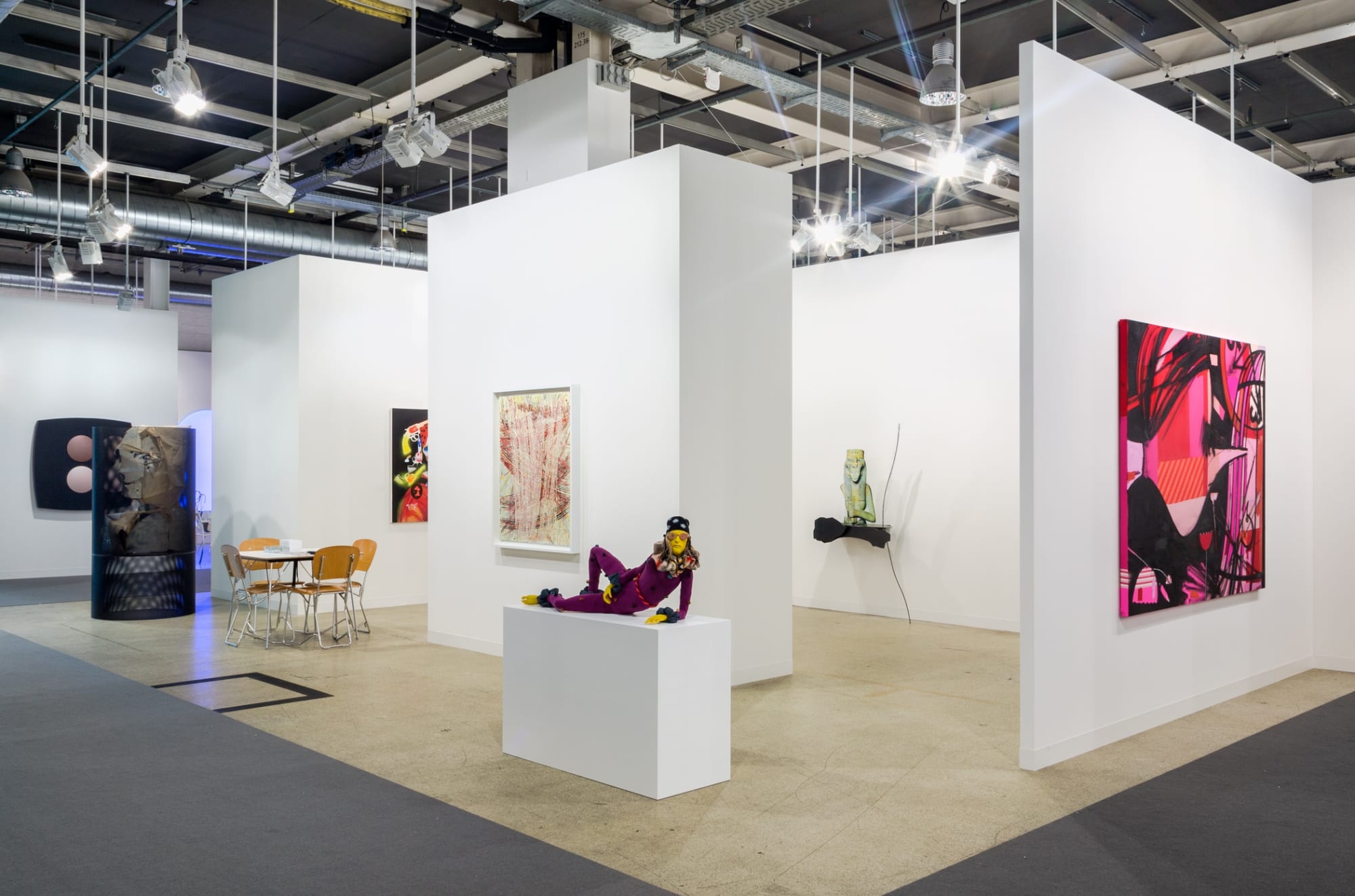 Installation view of Art Basel. featuring many artists in the gallery's program, among them Nicole Eisenman, Alessandro Pessoli, and Sasnal.