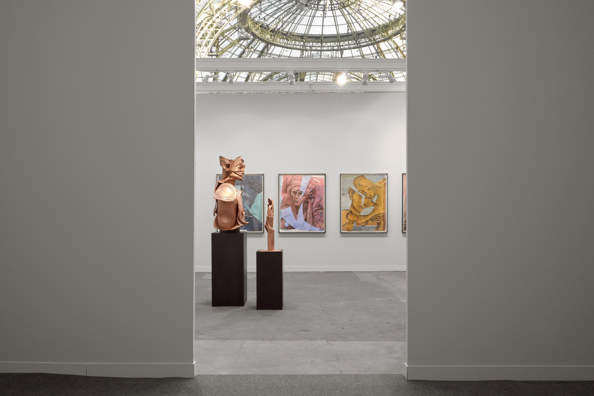 Matthew Monahan solo booth at FIAC filled with a variety of sculptures and paintings.