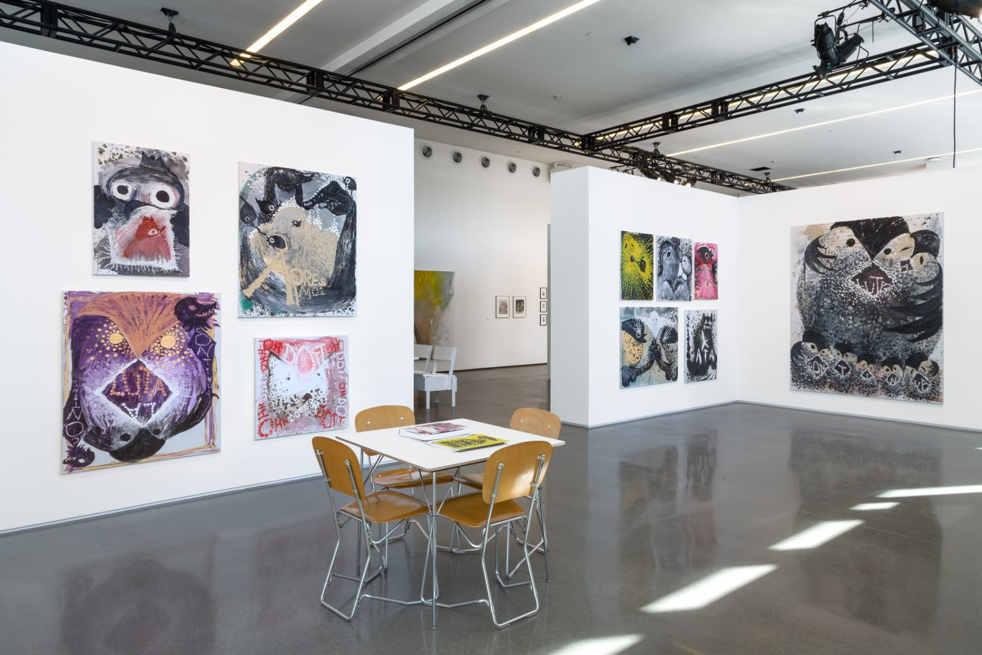 Installation view of Bendix Harm's solo booth at the Independent Art Fair featuring many paintings by him.